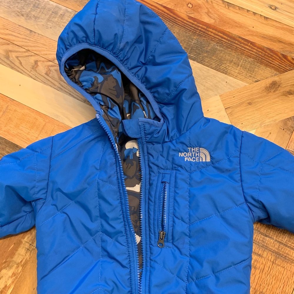 The North Face infant reversible winter jacket.